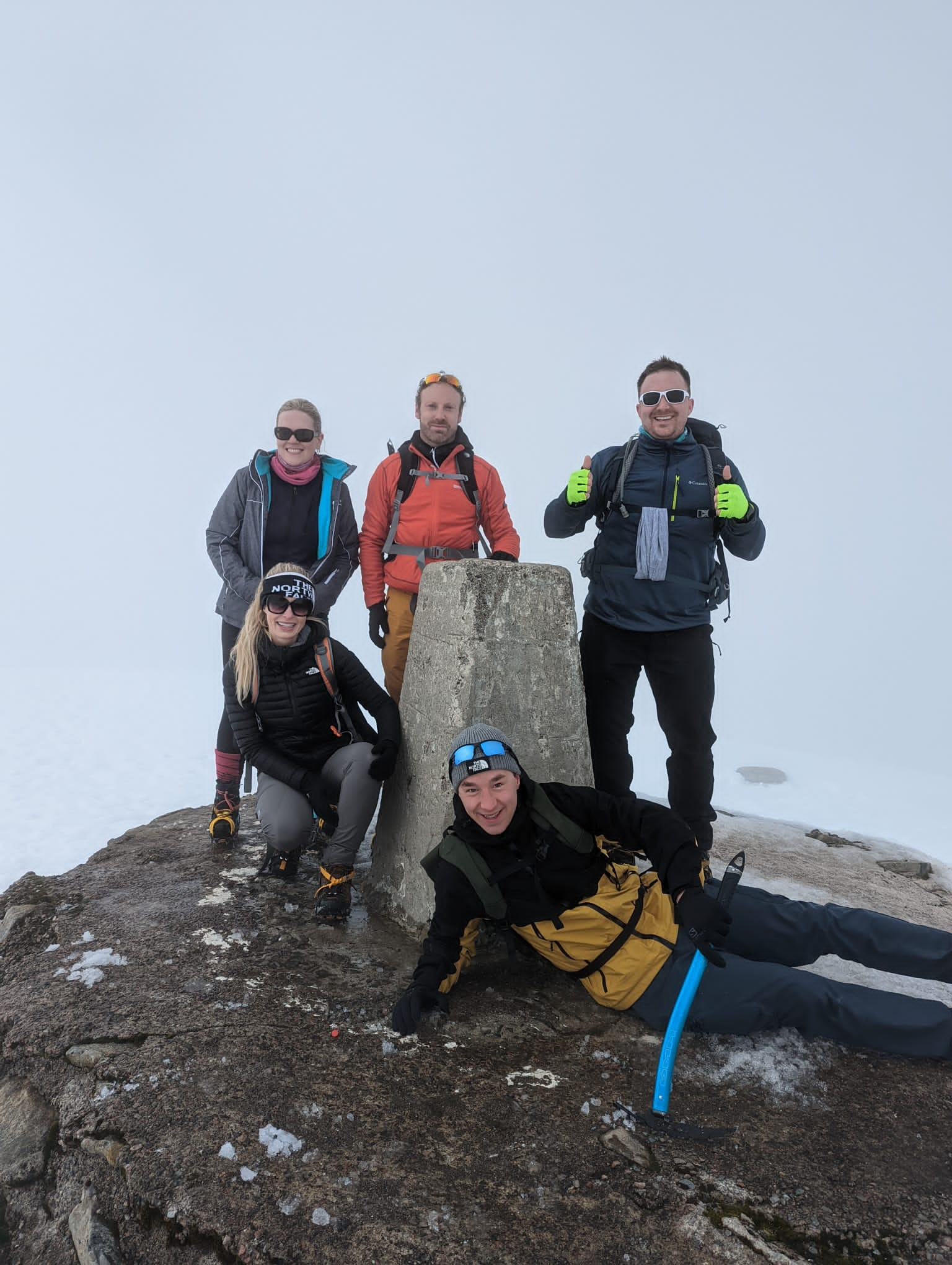 a rock at the peak of a mountain